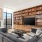 a living room with a large bookcase and a tv