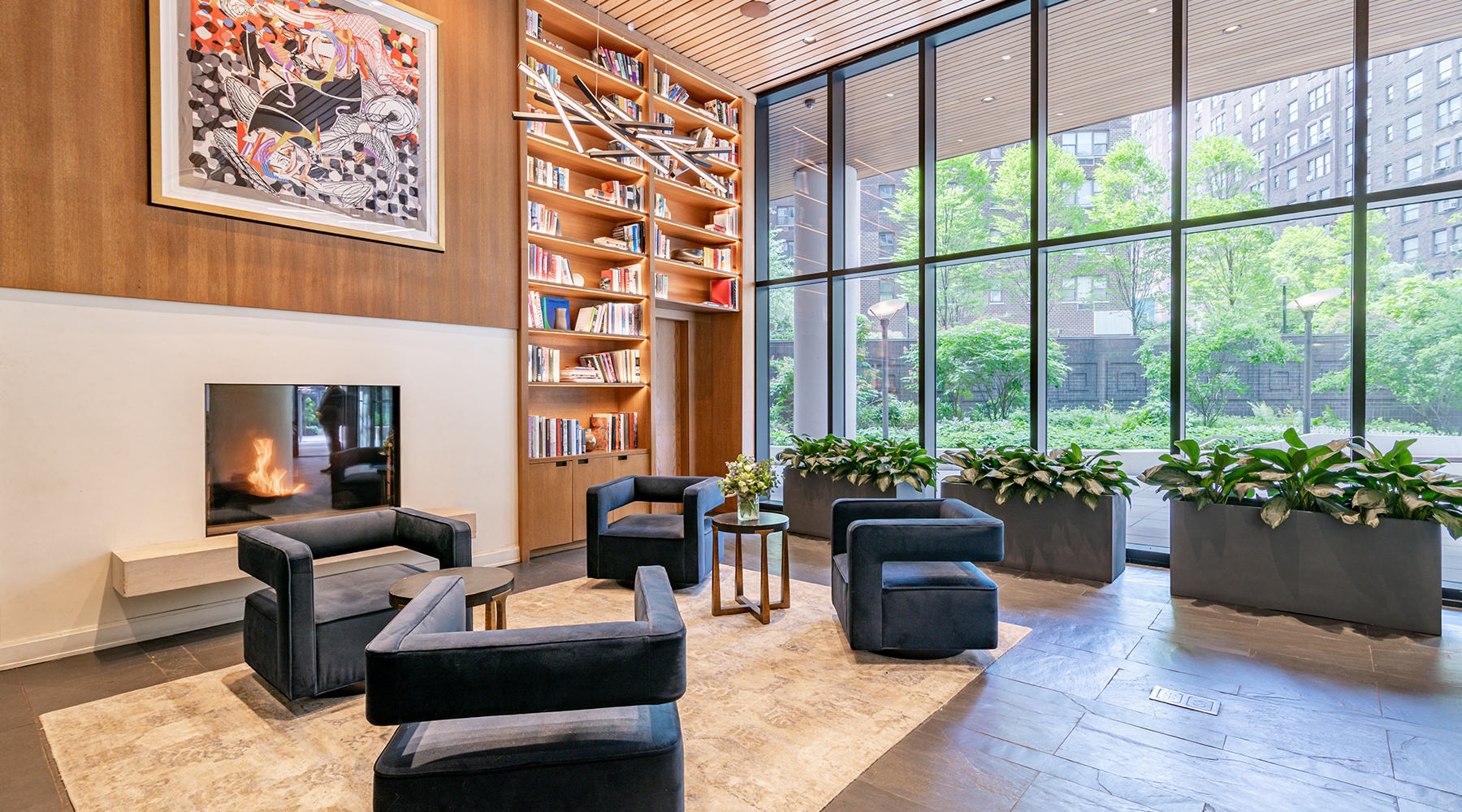 Access to Resident Only Features lobby with chairs fireplace and bookshelf