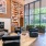 a room with a fireplace and chairs